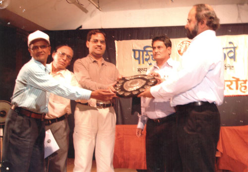 Principal receiving Best School Shield 2011